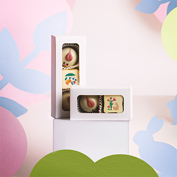 Osterpralinen K&uuml;ken mit Haselnussf&uuml;llung und Praline mit essbarem Aufdruck f&uuml;r Unternehmen