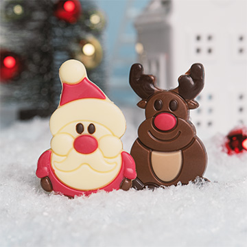Weihnachtsmann aus weißer Schokolade mit Rentier