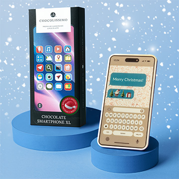 Ein Schokoladen-Smartphone in einer dekorativen Schachtel zu Weihnachten