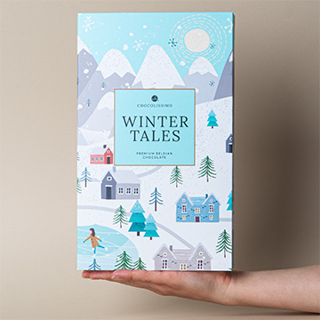 Adventskalender mit edlen Pralinen zur Hand