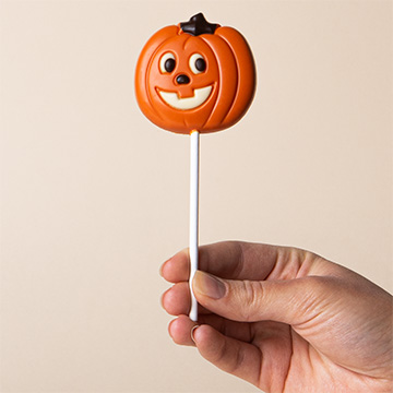 Dekorativer Halloween Schoko-Lolli in Kürbisform